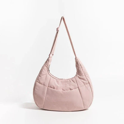 Chic Half Moon Puffer Shoulder Bag in Pink - Unique quilted design, secure zipper closure, and adjustable strap for everyday elegance