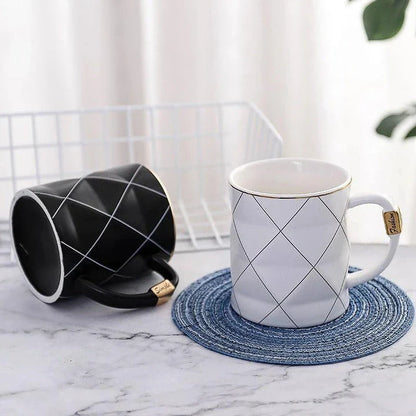 Elegant white ceramic mug with a geometric design, perfect for enjoying your favourite hot or cold beverages