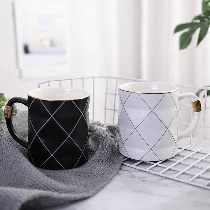 Elegant white ceramic mug with a geometric design, perfect for enjoying your favourite hot or cold beverages