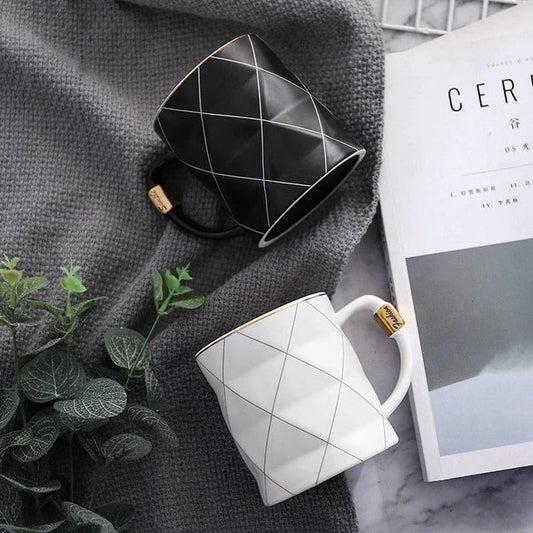 Elegant white ceramic mug with a geometric design, perfect for enjoying your favourite hot or cold beverages