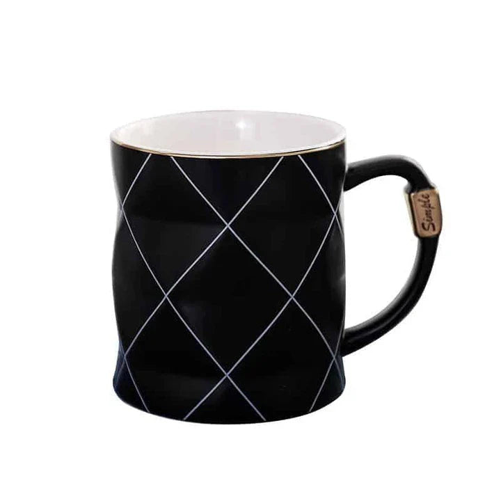 Elegant white ceramic mug with a geometric design, perfect for enjoying your favourite hot or cold beverages