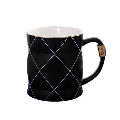 Elegant white ceramic mug with a geometric design, perfect for enjoying your favourite hot or cold beverages