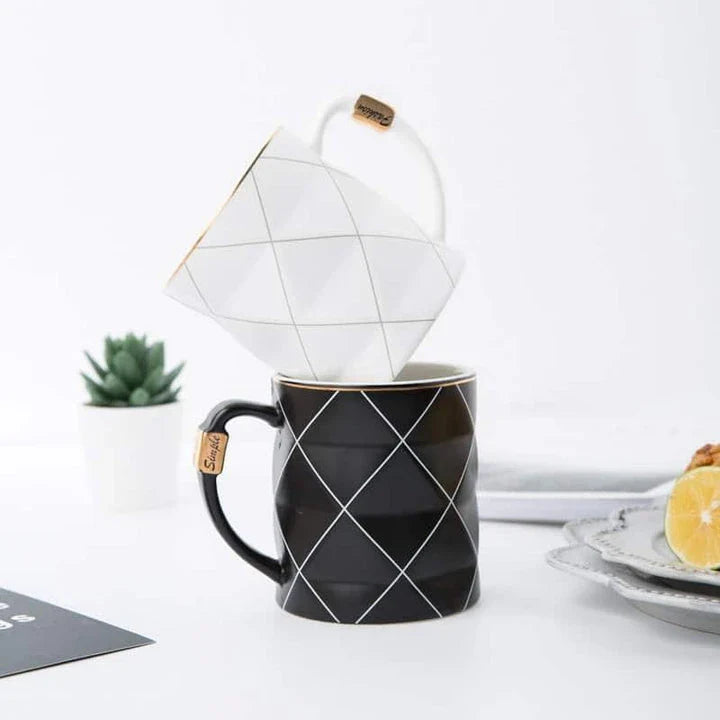 Elegant white ceramic mug with a geometric design, perfect for enjoying your favourite hot or cold beverages