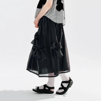 Chic Black Bow A-Line Midi Skirt for women, featuring a flattering A-line silhouette and elegant mid-calf length.