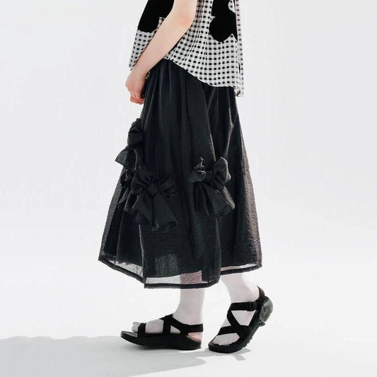 Chic Black Bow A-Line Midi Skirt for women, featuring a flattering A-line silhouette and elegant mid-calf length.
