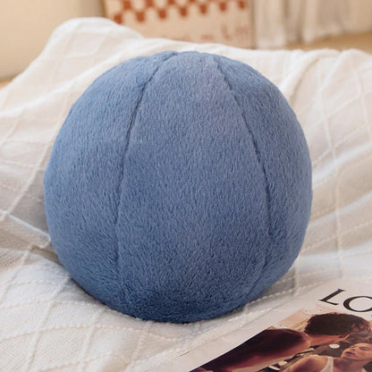 A soft, grey plush toy pillow with a round, furry design that adds a cosy and whimsical touch to home decor.