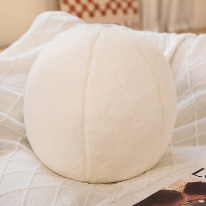 A soft, grey plush toy pillow with a round, furry design that adds a cosy and whimsical touch to home decor.