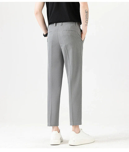 Light Luxury Men's Casual Small Trousers in various colours and sizes, featuring a stretch, pencil-leg design for a tailored, refined look.