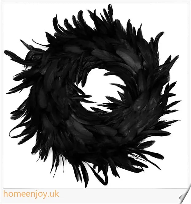 Black Halloween wreath made of luxurious natural feathers in shades of onyx, green, and purple