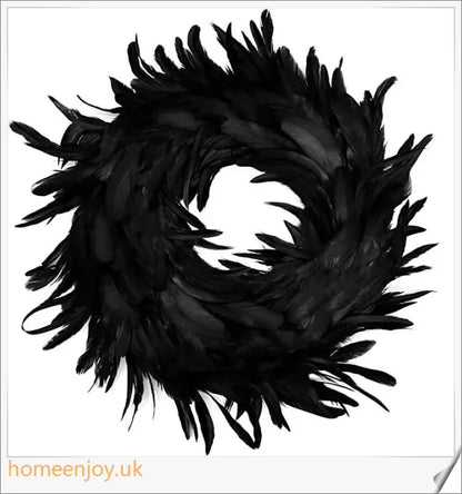 Black Halloween wreath made of luxurious natural feathers in shades of onyx, green, and purple