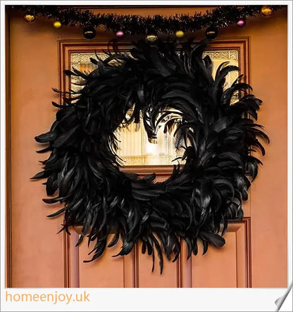 Black Halloween wreath made of luxurious natural feathers in shades of onyx, green, and purple