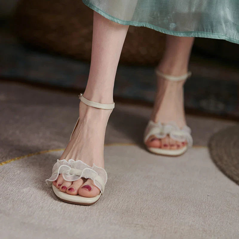Elegant square toe high heel sandals made with genuine leather and a unique buckle design