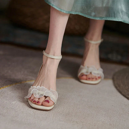 Elegant square toe high heel sandals made with genuine leather and a unique buckle design