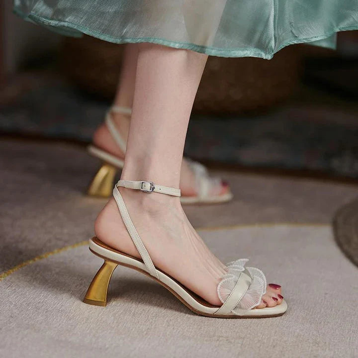 Elegant square toe high heel sandals made with genuine leather and a unique buckle design