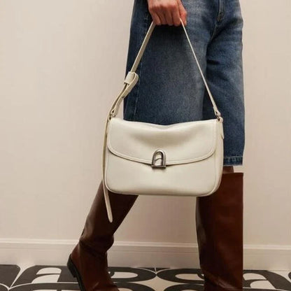 Elegant square-shaped burgundy leather shoulder and crossbody bag for women, featuring a modern design and spacious interior.