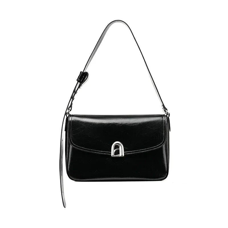 Elegant square-shaped burgundy leather shoulder and crossbody bag for women, featuring a modern design and spacious interior.