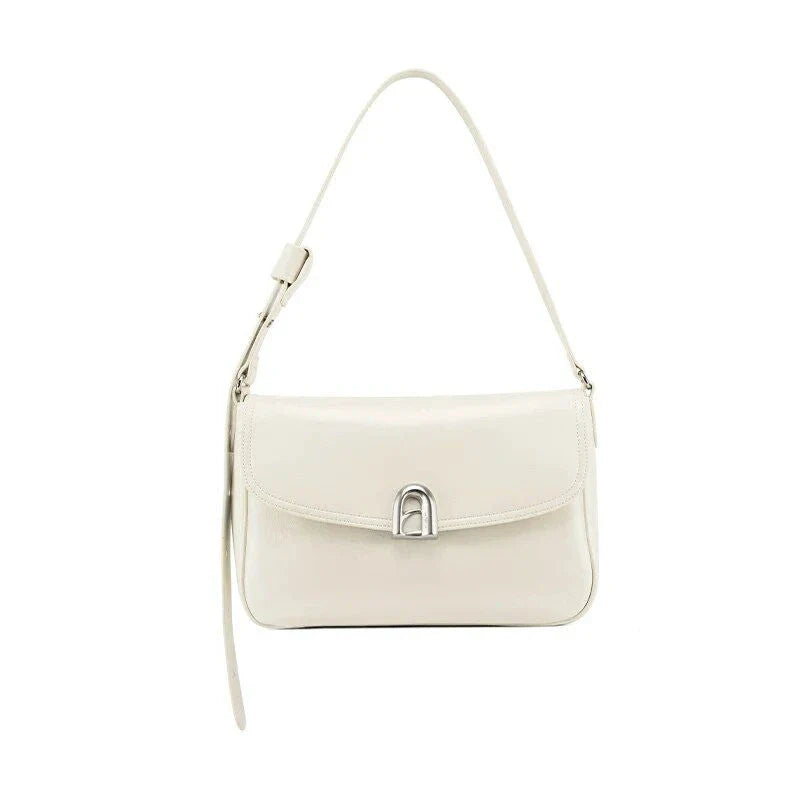 Elegant square-shaped burgundy leather shoulder and crossbody bag for women, featuring a modern design and spacious interior.