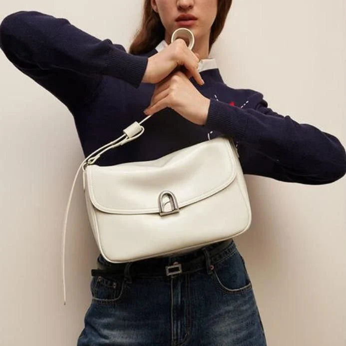 Elegant square-shaped burgundy leather shoulder and crossbody bag for women, featuring a modern design and spacious interior.