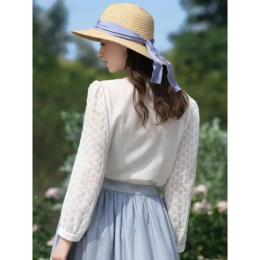 A French-inspired chic v-neck women's blouse in a crisp white colour, featuring a stylish spliced design and a flattering, tailored silhouette.