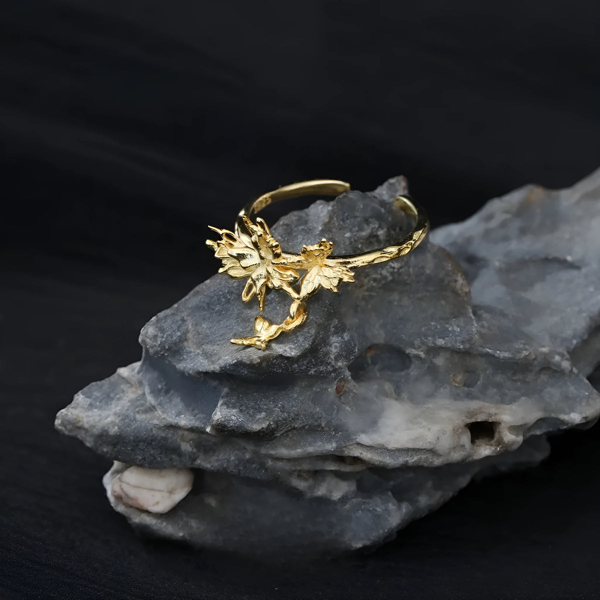 Adjustable open silver ring with a wild butterfly design in a choice of metallic finishes.