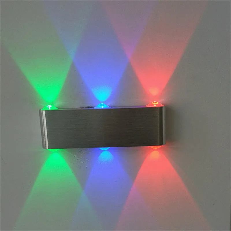 Silver rectangular aluminium LED wall lamp showing multi-colour light options.