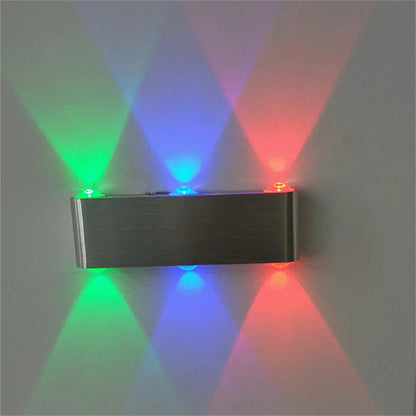 Silver rectangular aluminium LED wall lamp showing multi-colour light options.