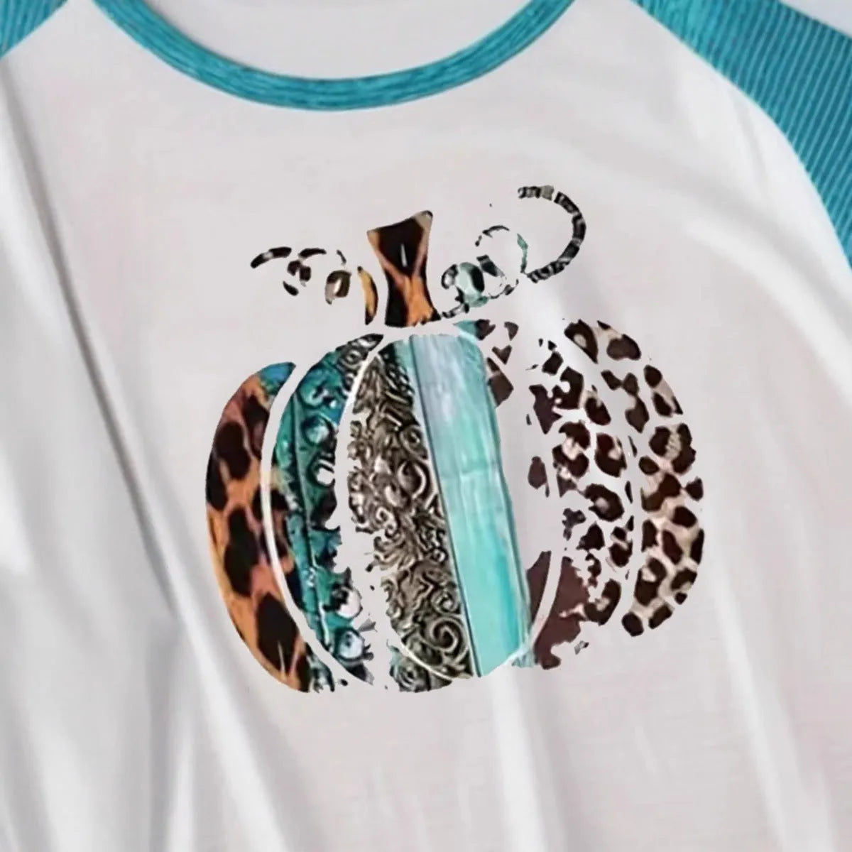 Sky blue long sleeve t-shirt with a large 3D printed Halloween pumpkin design on the front.