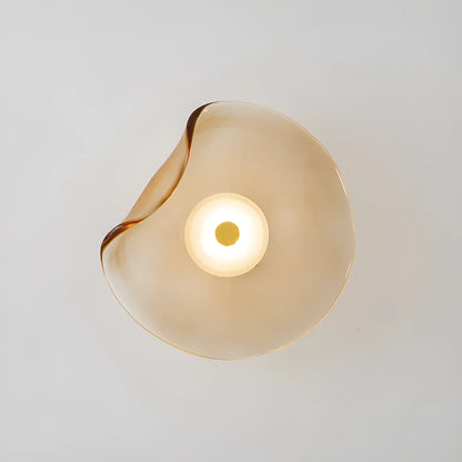 Round glass wall lamp mounted beside bed in cognac colour with 220V operation for bedside lighting