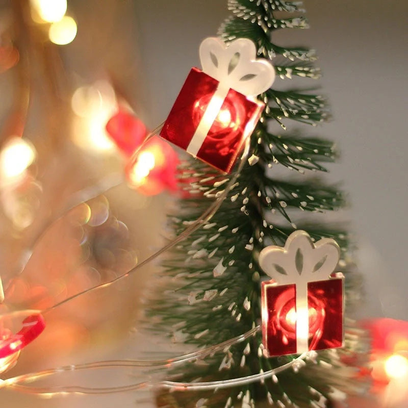 Copper wire LED Christmas decoration lights featuring festive designs like bells, trees, and elks