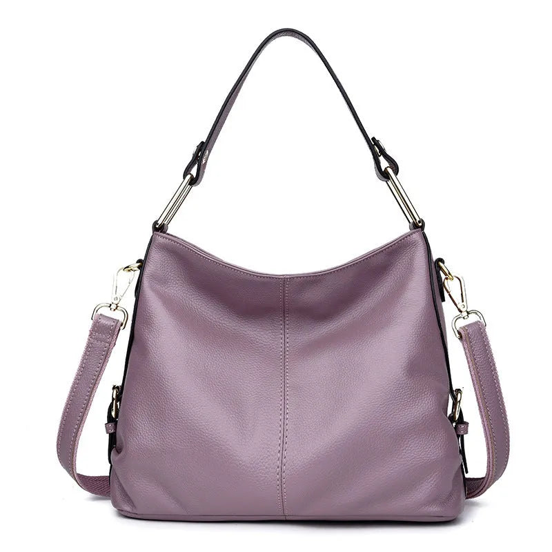 Black genuine leather vertical crossbody bag with multiple internal compartments and a sandwich pocket.