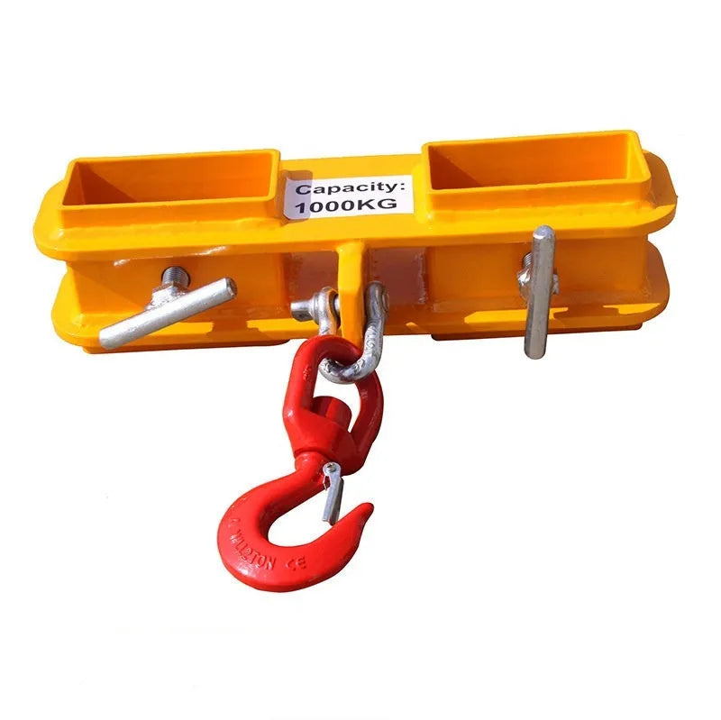 Heavy-duty iron forklift hook with rotatable drum and safety locking latch, shown mounted on forklift forks.