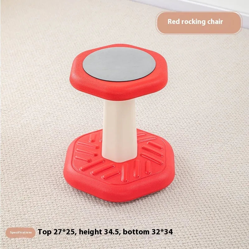 Balance children's plastic rocking stool in blue colour on a wooden floor.