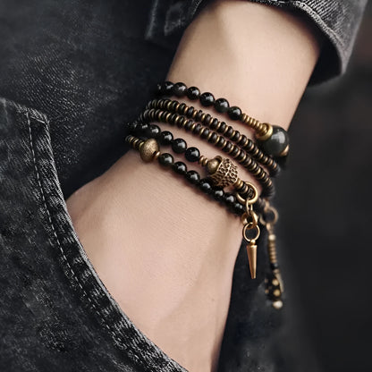 Black geometric beaded bracelet with multi-layered colourful design on wrist