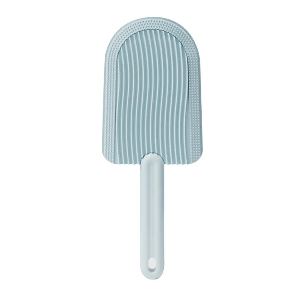 Foldable blue pet grooming brush with silicone teeth on a white background