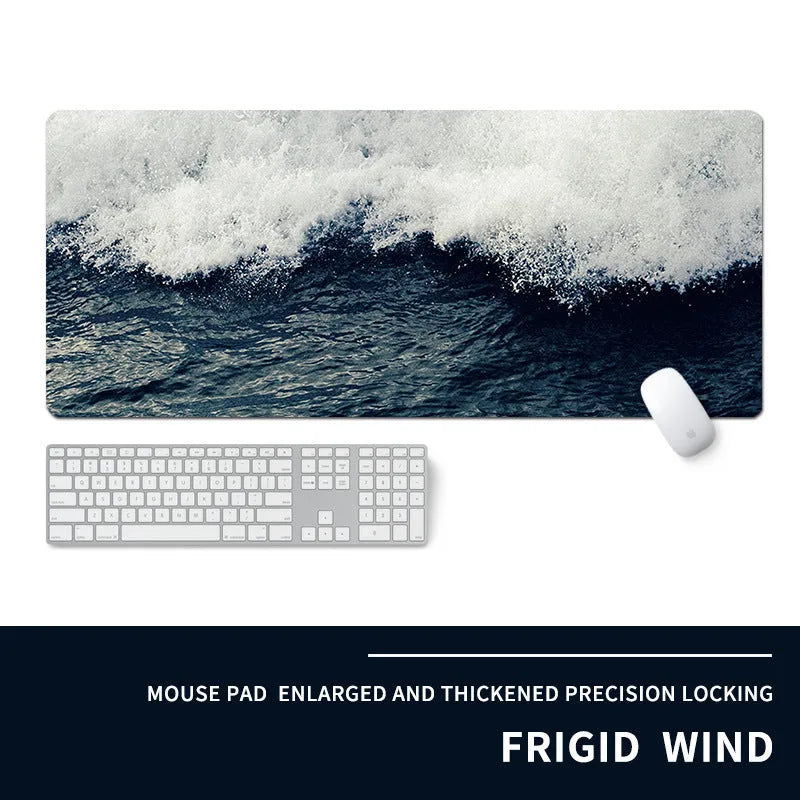 Oversized rectangular mouse pad with a printed design on a desk, next to a keyboard and mouse.