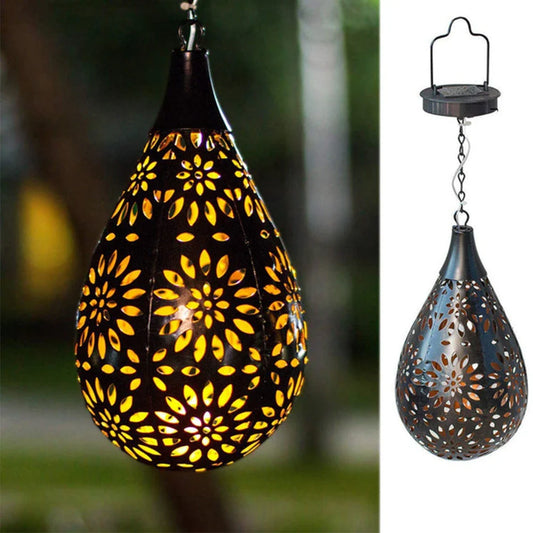 Elegant solar-powered garden lantern with a drop-shaped metal design and a soft, flower-patterned glow