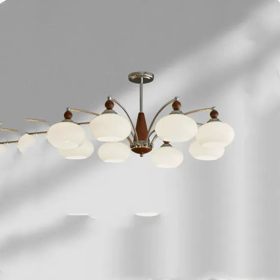 Persimmon glass chandelier with chrome frame in Middle Ancient style, shown with multiple glass shades.