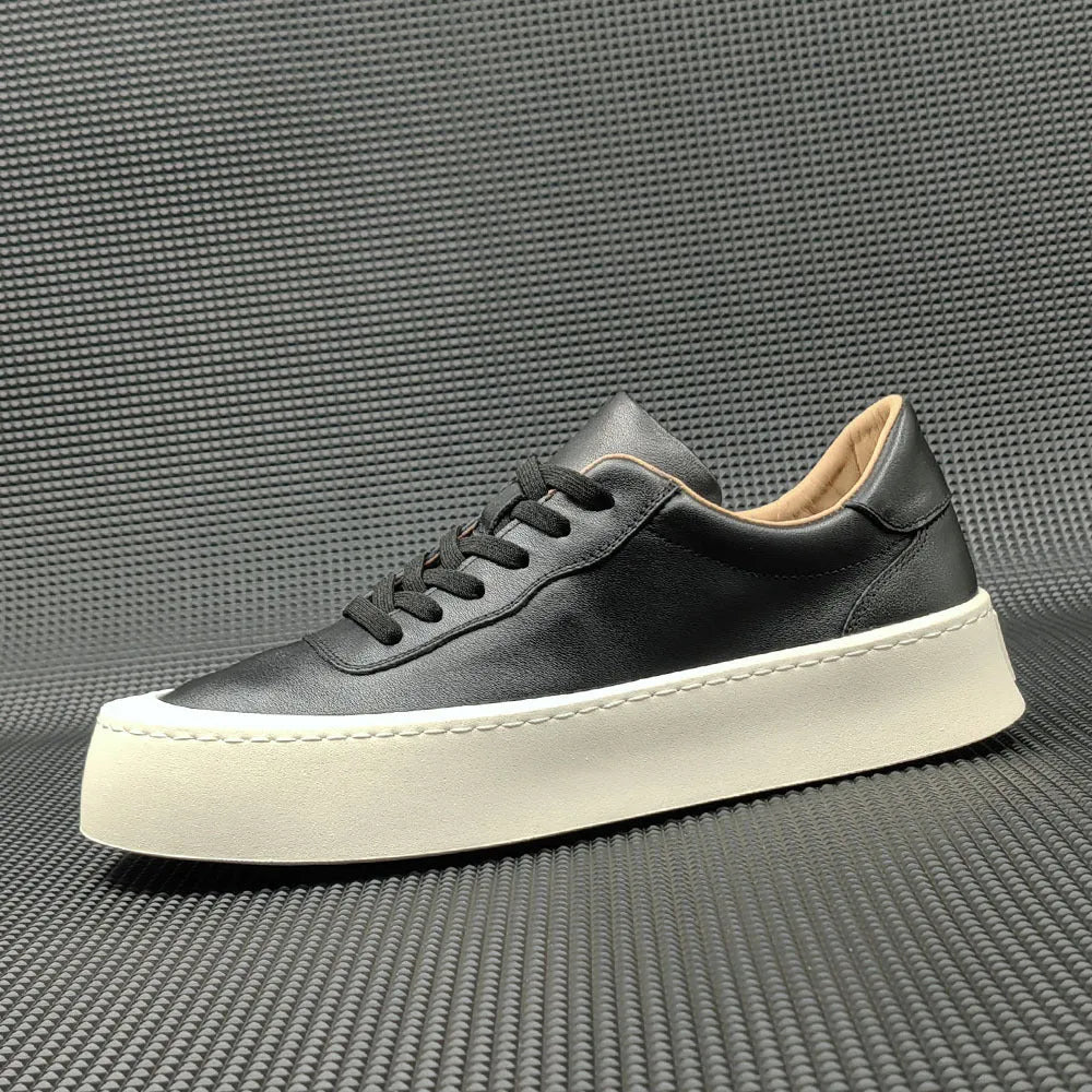 Men's white genuine cowhide board shoes with a thick rubber platform sole and round toe.