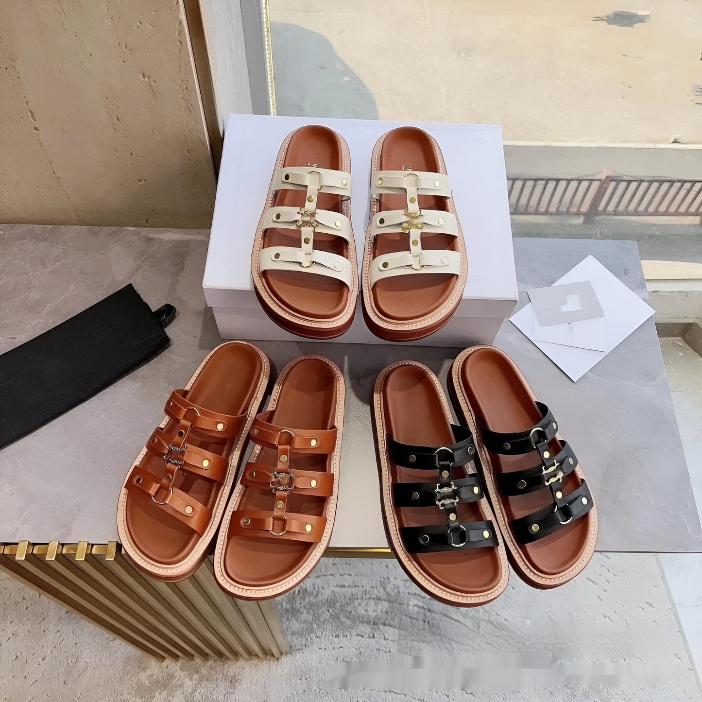 Women's white Roman sandal slippers with sheepskin upper and patent leather straps.