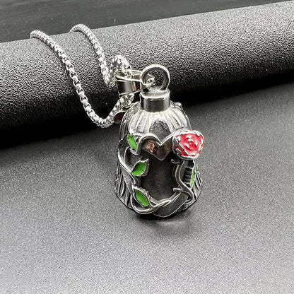 Polished titanium steel motorcycle bell with clear epoxy rose detail, shown from the side.