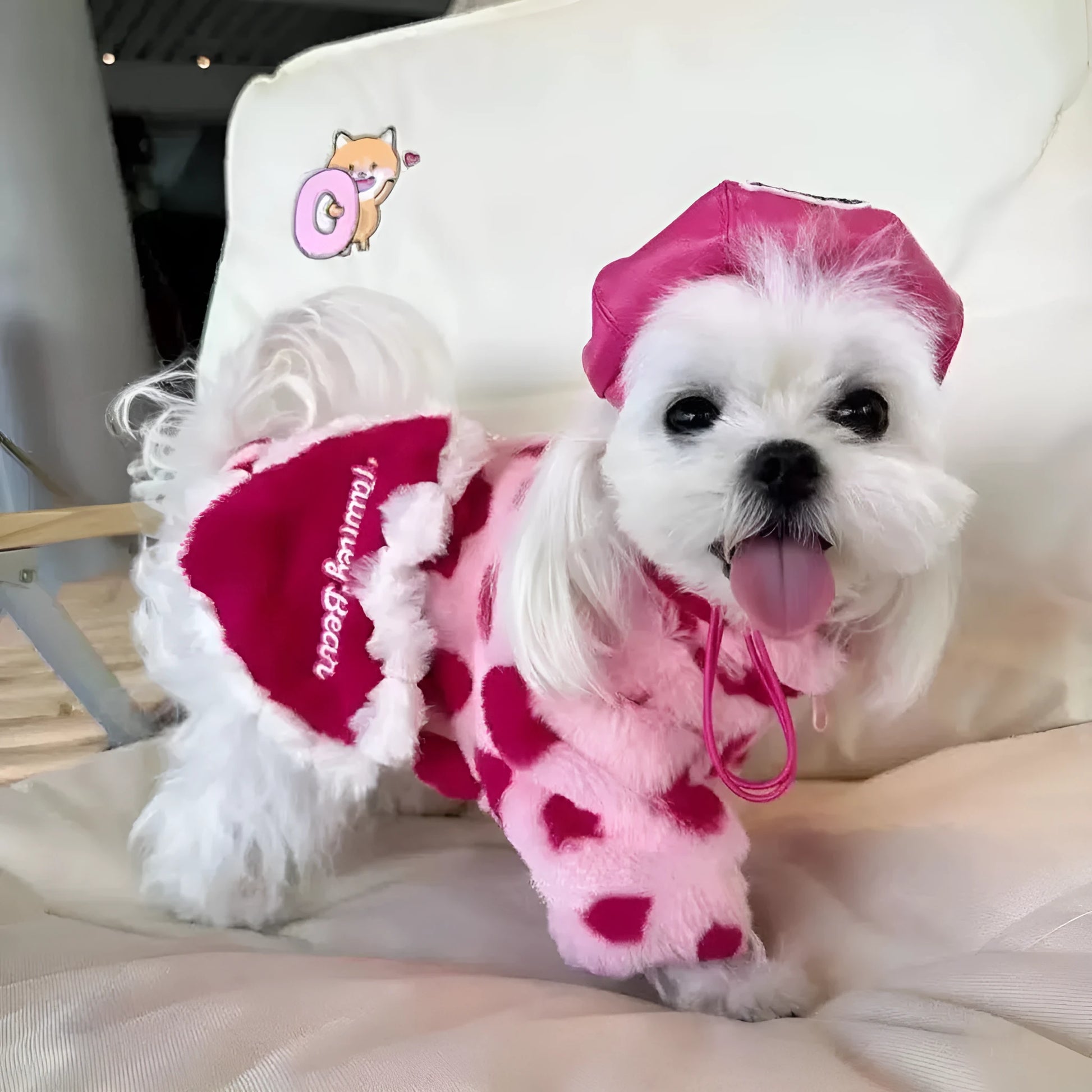 Pink plush warm coat on small dog showing British style design with polyester construction