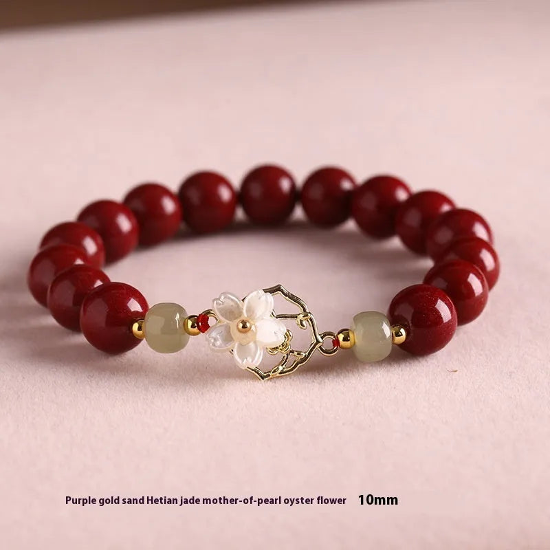 Handcrafted cinnabar bracelet with Hetian jade elements and lotus motifs in New Chinese style showing purple gold sand and emperor sandstone colour options