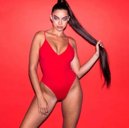 A stylish, backless one-piece swimsuit in a variety of vibrant colors for women's summer fashion.