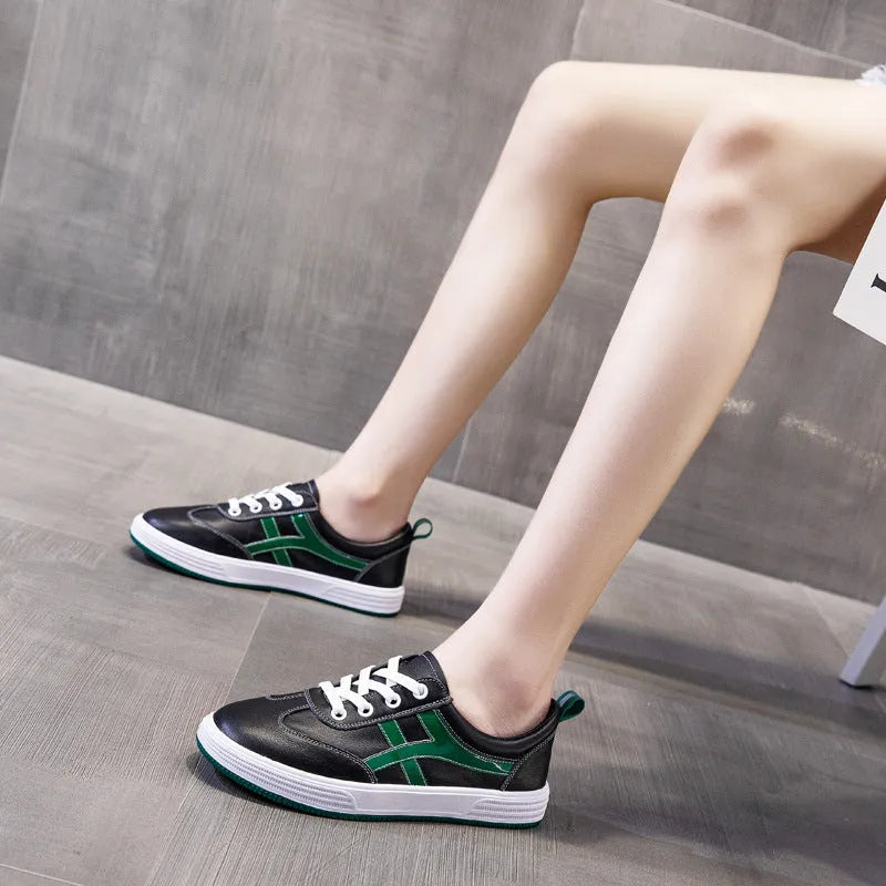 Cowhide leather casual sneakers with elastic band wearing in black or white colours, low top design with round toe