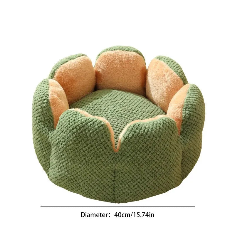 Green petal cactus-shaped plush cat bed with a cave-like opening on a wooden floor