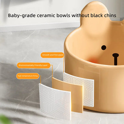 Blush Critter ceramic pet bowls in white rabbit and brown bear designs, showing neck protection rim.