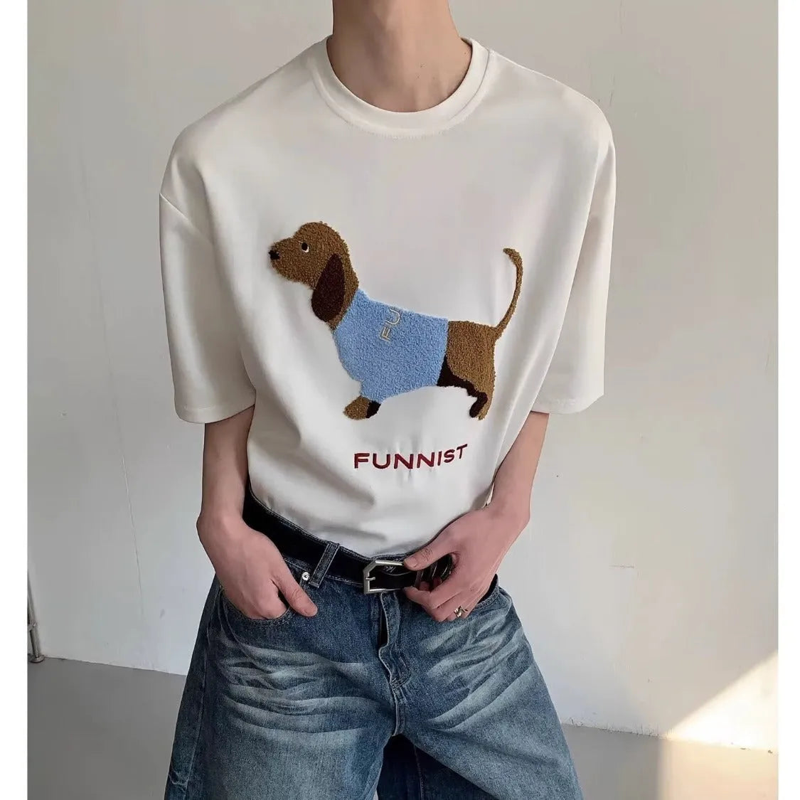 Men's black cotton T-shirt with embroidered sausage dog wrapped in a towel design