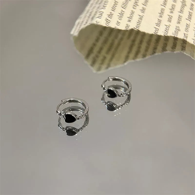 Black love heart earrings for women with alloy construction and ear clip design