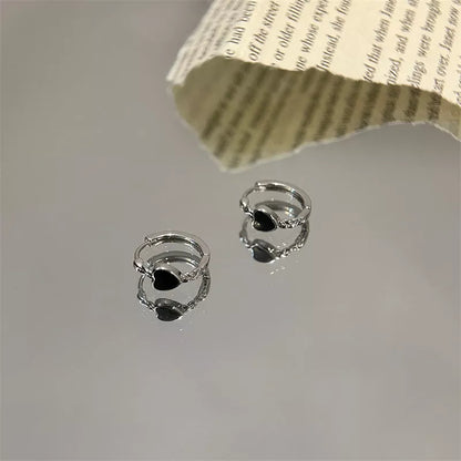 Black love heart earrings for women with alloy construction and ear clip design