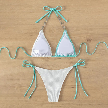 Women's colour matching swimsuit with lace-up detail and pearl chain decoration
